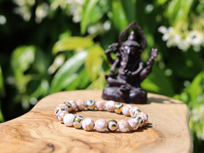 Electroplate Glass Beads, Evil eye bracelet and White Turquoise Gold Color Wire Pine beads. With love, care and a little magic.