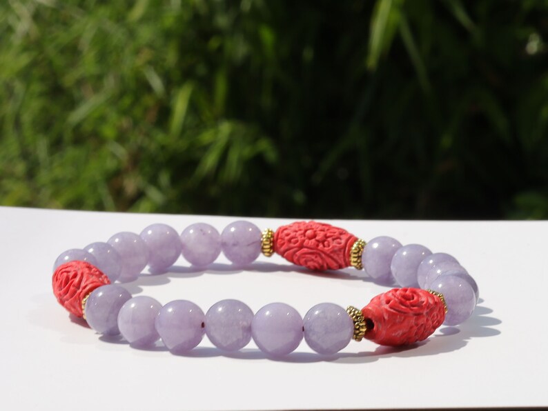 Carved Cinnabar Beads with rare Lepidolite  and  Tibetan Style Alloy Spacer Discs. minerals such as quartz, feldspar, and tourmaline