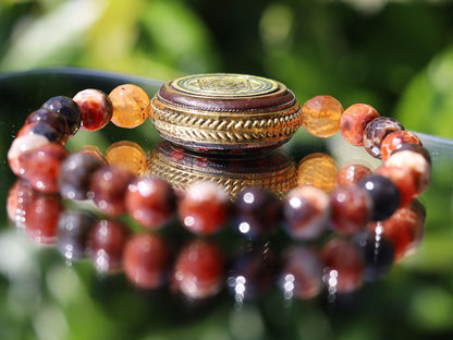 Unique, one of a kind Fire Crackle Agate bracelet with Ethnic Handmade Nepal Pendant God Of Wealth. bodhi, jade line, copper, sandalwood