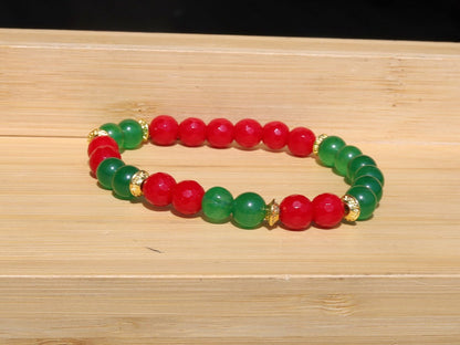 Natural Faceted Red Coral Stone bracelet with Green  Jade and Tibetan Style Alloy Spacer Discs.  Exquisite workmanship and great design!