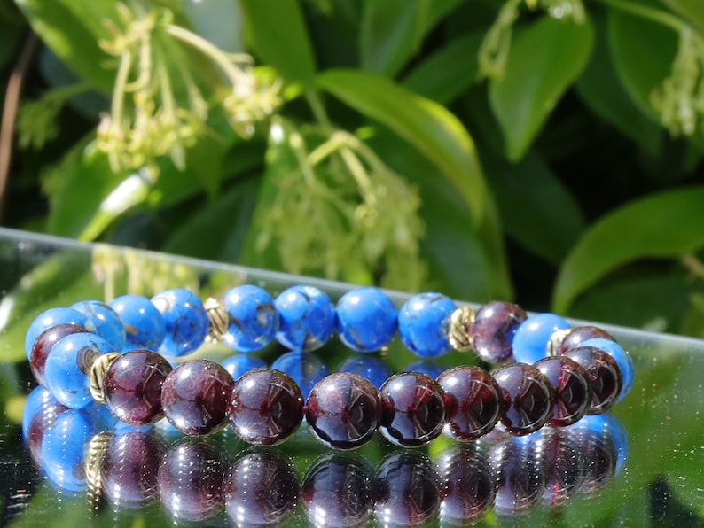 Blue Turquoise Shell Howlite beads and Red Garnet r stones.  Jewelry is a powerful way to express your individuality and unique style