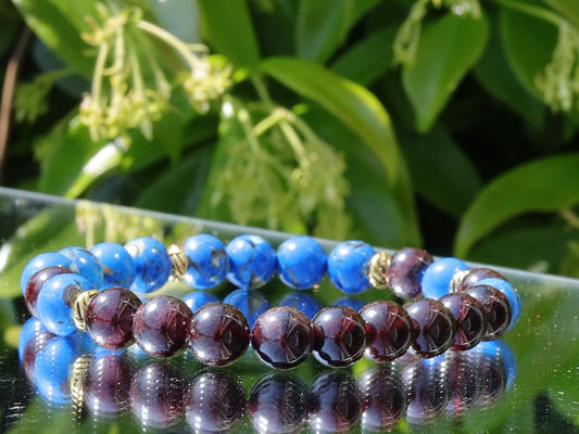 Blue Turquoise Shell Howlite beads and Red Garnet r stones.  Jewelry is a powerful way to express your individuality and unique style