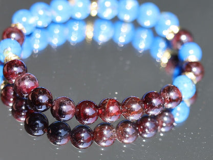 Blue Turquoise Shell Howlite beads and Red Garnet r stones.  Jewelry is a powerful way to express your individuality and unique style