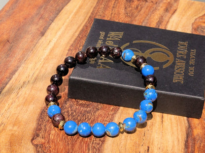Blue Turquoise Shell Howlite beads and Red Garnet r stones.  Jewelry is a powerful way to express your individuality and unique style