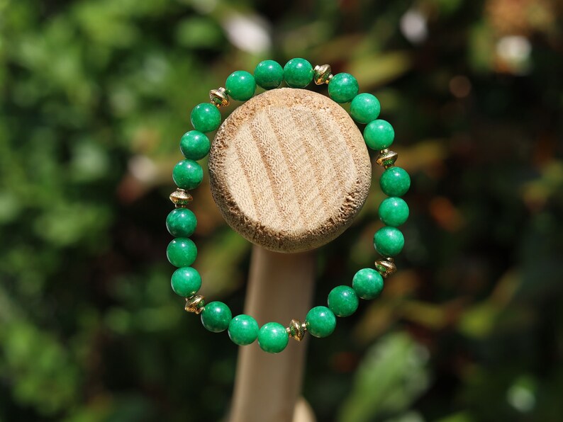 Natural Green Lace Jade with Tibetan Style Alloy Spacer Discs. is associated with balancing emotions, promoting harmony