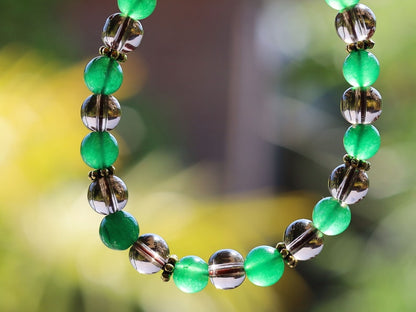 Smoky quartz bracelet with Green jade and Tibetan alloy material in Antique Gold. often associated with stability, protection