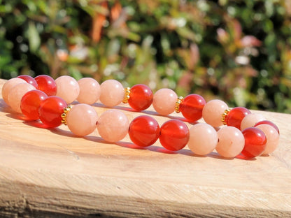 Sun stone bracelet with Carnelian red beads and . Tibetan alloy material in Antique Gold. The energy of the sun