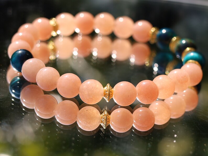 Multicolor Blue Tiger Eye Stone combined with captivating Sunstone. Blue Tiger Eye, also known as Hawk's Eye. improve communication