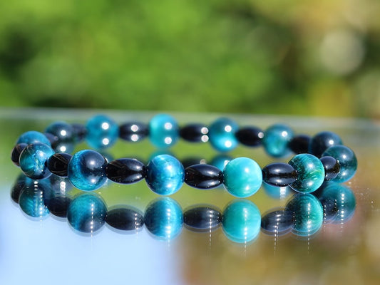 Natural Black Agate Barrel Beads with  Blue Tiger Eye, also known as Hawk's Eye beads. making it a beneficial stone for students and artists