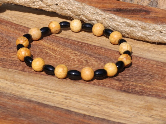 Unique Palo Santo Wood bracelet combined with Natural Black Agate Barrel Beads. Perfect handmade gifts and on-trend unique jewelry.