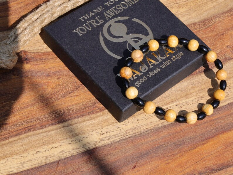 Unique Palo Santo Wood bracelet combined with Natural Black Agate Barrel Beads. Perfect handmade gifts and on-trend unique jewelry.
