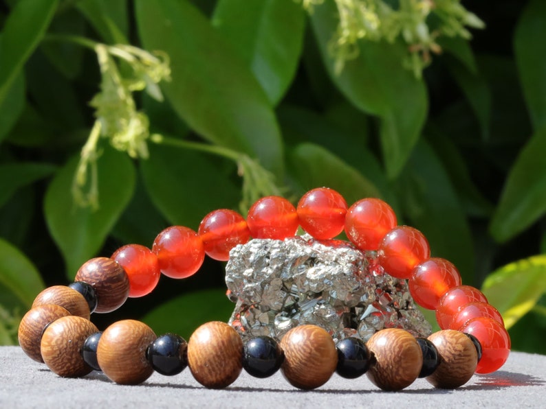 Unique Madre de Cacao Wood bracelet combined with Carnelian red beads. And Black Round Natural Wood Beads. unique style