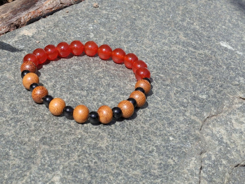 Unique Madre de Cacao Wood bracelet combined with Carnelian red beads. And Black Round Natural Wood Beads. unique style
