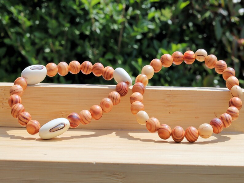 Wooden Bracelet Set. Raja Kayu matte beaded bracelets with Acai broken white seeds and Huayruro white 20mm seeds beads.