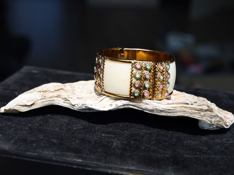 Kriaa Gold Plated Multicolor Stone Kada. Indian jewelry is known for its intricate designs and rich cultural significance.