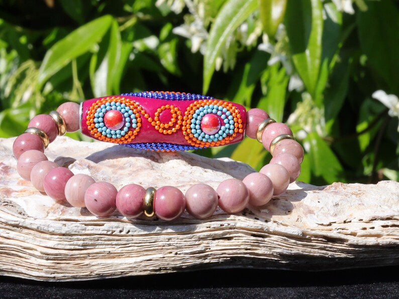 Rice Handmade Indonesia bracelet with Rhodochrosite beads and Tibetan Style Alloy Spacer Discs. The art of expressing your taste and style