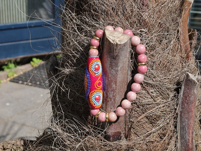 Rice Handmade Indonesia bracelet with Rhodochrosite beads and Tibetan Style Alloy Spacer Discs. The art of expressing your taste and style