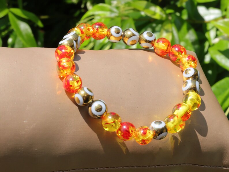 Yellow/Red acrylic beads with Electroplate Glass Beads Strands, Round with Evil Eye Pattern, gold color. protecting the wearer from harm
