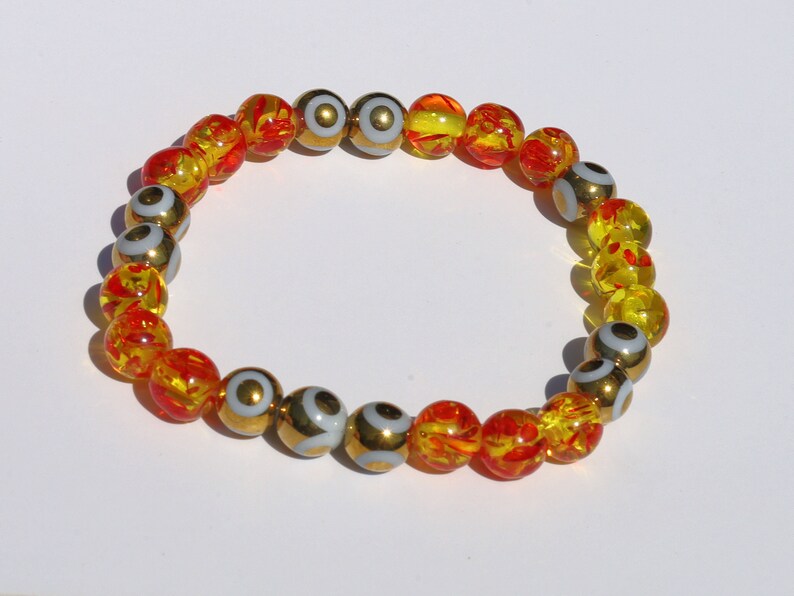Yellow/Red acrylic beads with Electroplate Glass Beads Strands, Round with Evil Eye Pattern, gold color. protecting the wearer from harm