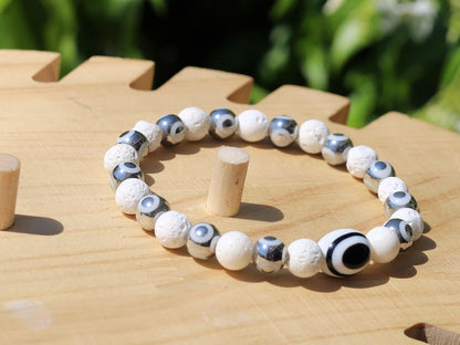 Electroplate Glass Beads, Evil eye bracelet white lave beads. grounding and metaphysical properties associated with lava beads.