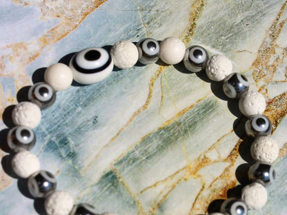 Electroplate Glass Beads, Evil eye bracelet white lave beads. grounding and metaphysical properties associated with lava beads.