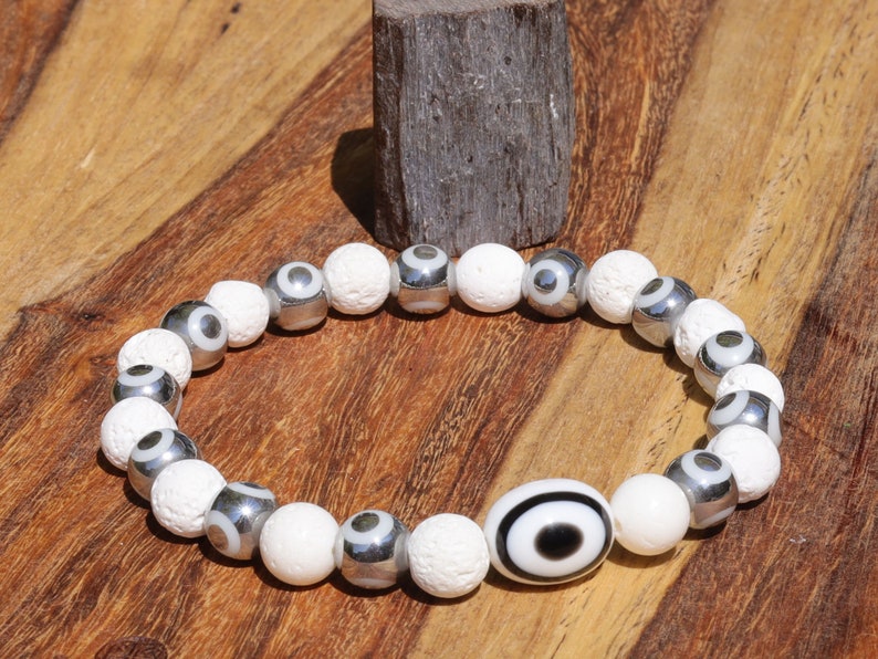 Electroplate Glass Beads, Evil eye bracelet white lave beads. grounding and metaphysical properties associated with lava beads.