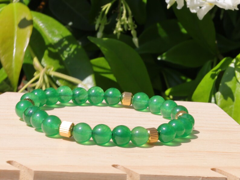 Green jade and  Stainless Steel Beads Gold Color spacer beads. Green Jade is particularly associated with the heart chakra,representing love