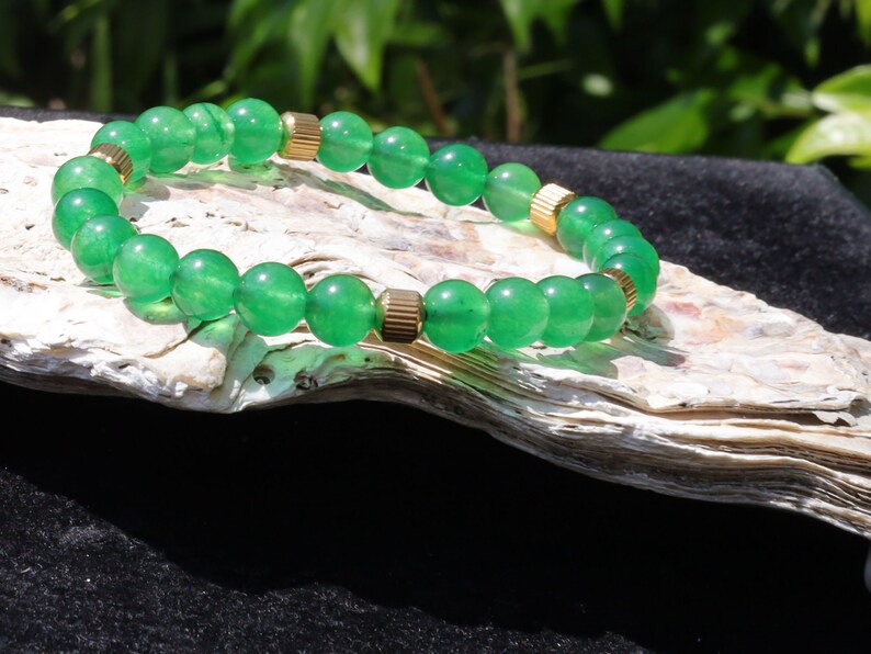 Green jade and  Stainless Steel Beads Gold Color spacer beads. Green Jade is particularly associated with the heart chakra,representing love