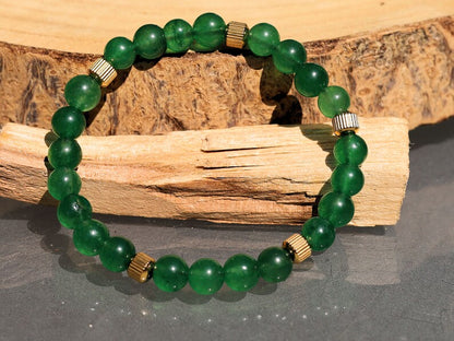 Green jade and  Stainless Steel Beads Gold Color spacer beads. Green Jade is particularly associated with the heart chakra,representing love