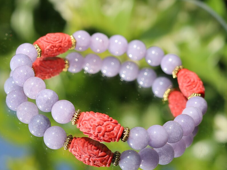 Carved Cinnabar Beads with rare Lepidolite  and  Tibetan Style Alloy Spacer Discs. minerals such as quartz, feldspar, and tourmaline