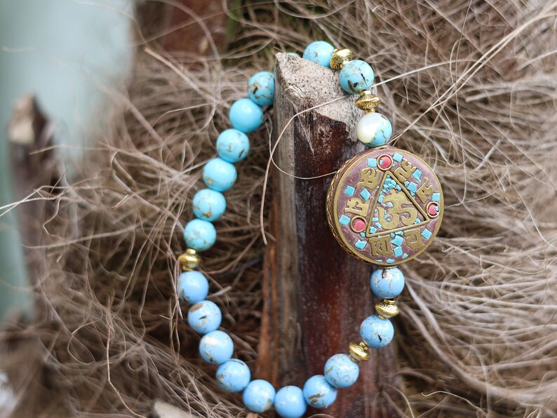 Unique bi color Blue Gold Turquoises Agate bracelet. Combined with Handmade Indonesia Bead,  Nickel Free, Flat Round with Om Symbol