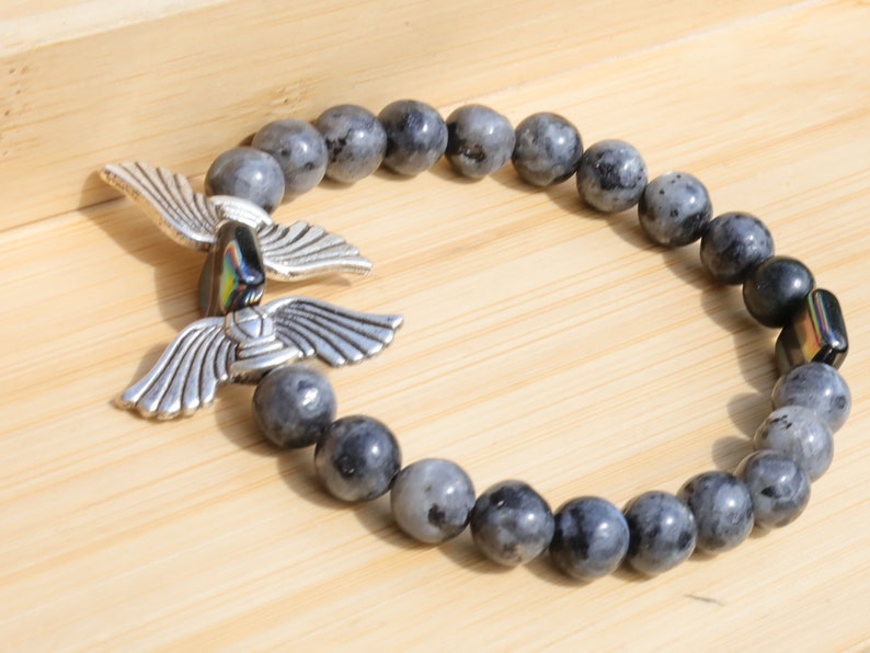 Angel Wings Beads combined with Labradorite. Angel wing beads in jewelry can hold personal significance and symbolism for individuals
