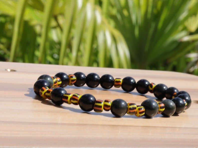 Antique African tradebeads - originally made in Europe (Bohemia) with Obsidian beads. possess protective qualities