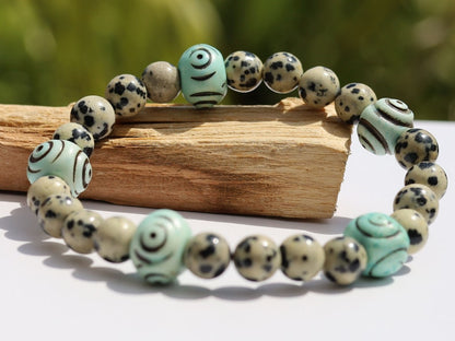 Dalmatian Jasper beaded bracelet with Hand Carved Target Bone Beads. The art of expressing your taste and style.