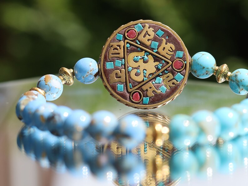 Unique bi color Blue Gold Turquoises Agate bracelet. Combined with Handmade Indonesia Bead,  Nickel Free, Flat Round with Om Symbol