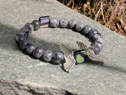 Angel Wings Beads combined with Labradorite. Angel wing beads in jewelry can hold personal significance and symbolism for individuals