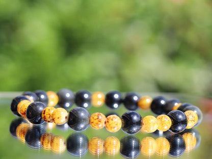 Beautiful Marble-look Glass beads with Obsidian beads. helping to shield against negative energies and promoting grounding and balance