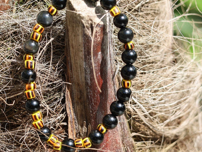 Antique African tradebeads - originally made in Europe (Bohemia) with Obsidian beads. possess protective qualities