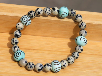 Dalmatian Jasper beaded bracelet with Hand Carved Target Bone Beads. The art of expressing your taste and style.