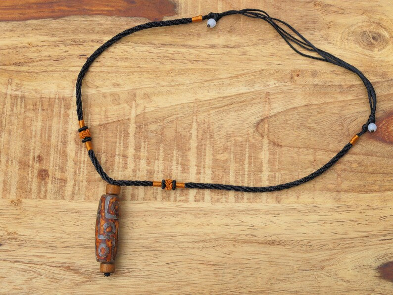 Rare Agate Tibetan 9 Eye DZI pendant. With Hand Knotted Adjustable Cord String Necklace. a wide range of positive and beneficial attributes