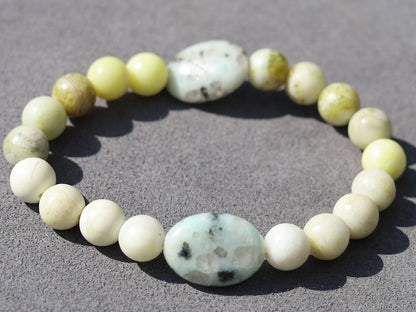 Yellow Turquoise bracelet with A beautiful set of 2 oval beads: real Kiwi Jasper. Yellow Turquoise enhances intuition and personal power.