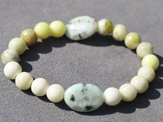 Yellow Turquoise bracelet with A beautiful set of 2 oval beads: real Kiwi Jasper. Yellow Turquoise enhances intuition and personal power.