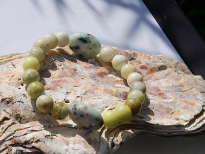 Yellow Turquoise bracelet with A beautiful set of 2 oval beads: real Kiwi Jasper. Yellow Turquoise enhances intuition and personal power.
