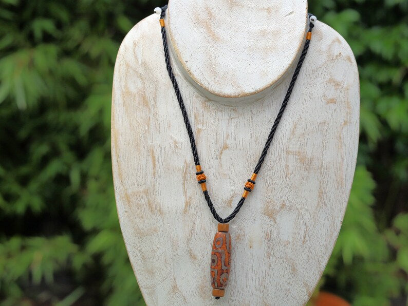 Rare Agate Tibetan 9 Eye DZI pendant. With Hand Knotted Adjustable Cord String Necklace. a wide range of positive and beneficial attributes
