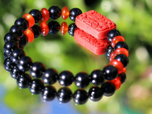 Onyx is a beautiful and unique gemstone. Combined with beautiful, large handcrafted Buddhist bead from real Cinnabar.