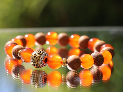 Madre de Cacao Wood beads with Carnelian  and Great Bright Mantra Om Bead. mantra's essence is powerful and pure