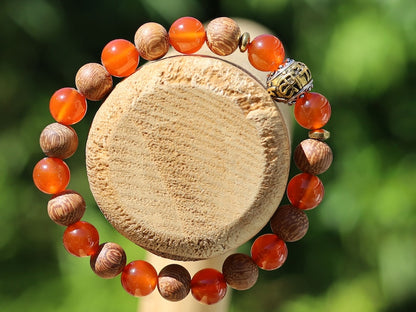 Madre de Cacao Wood beads with Carnelian  and Great Bright Mantra Om Bead. mantra's essence is powerful and pure