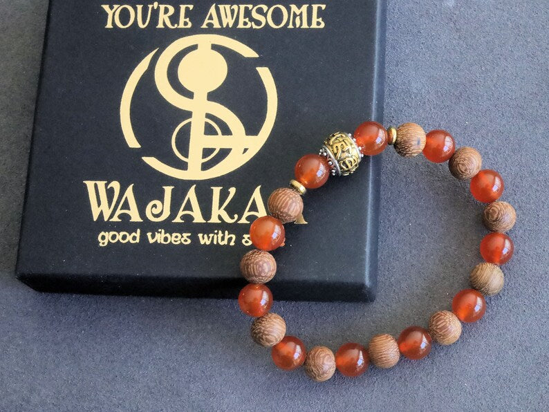 Madre de Cacao Wood beads with Carnelian  and Great Bright Mantra Om Bead. mantra's essence is powerful and pure