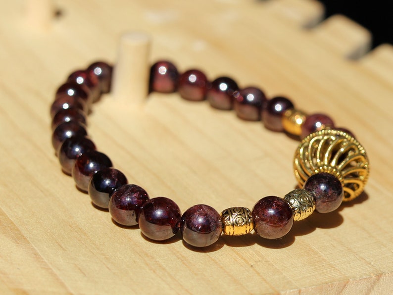 Amazing Dark Red Garnet beaded bracelet with Lovely, large Mala bead and Handmade Indonesia Beads. expressing your taste and style