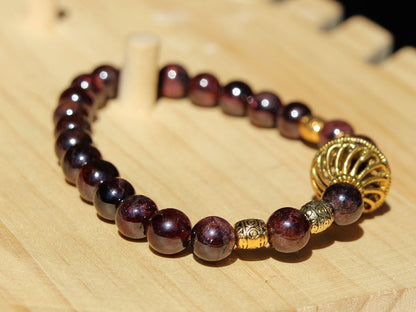 Amazing Dark Red Garnet beaded bracelet with Lovely, large Mala bead and Handmade Indonesia Beads. expressing your taste and style